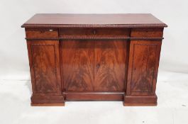 20th century mahogany sideboard with applied moulded edge above two short and one long central
