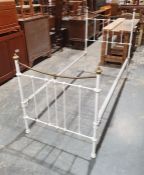 White painted tubular metal and brass single bedframe