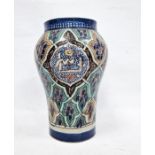 Middle Eastern inverse baluster vase with panelled decoration, indistinctly signed to base, 27cm