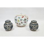 20th century lidded ovoid pot in the Chinese taste, decorated with butterflies and two ginger