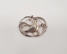 Danish silver brooch in the form of a bird within a scrollwork frame