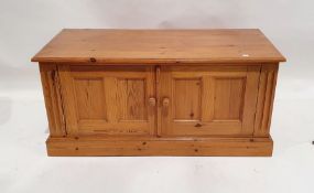 Modern pine chest of two short over two long drawers and a low two-door cupboard on plinth base (2)