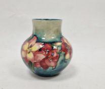 Moorcroft vase, the ovoid body with floral decoration, initialled WM in blue to base, 12cm high