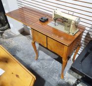 20th century walnut cabinet with Necchi Supernova automatic sewing machine