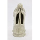 Chinese ceramic figure of monk in prayer with faint mark to base, 24cm high