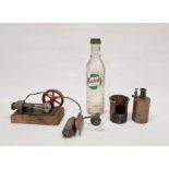 Vintage static steam engine and a vintage glass Castrol motor oil bottle (2)