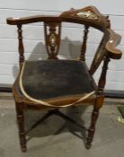 Corner chair with upholstered seat, on turned front legs, X-shaped stretcher base and a spindle back