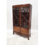 Early 20th century mahogany cabinet, the astragal-glazed doors on splayed supports, 176cm x 104cm