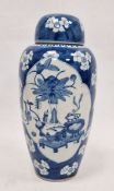 Chinese lidded vase, the body of slight tapering form, blue and white set with panels featuring