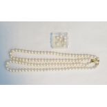 A double string of cultured pearls on a 14ct gold clasp, marked 585, in a Crouch The Goldsmiths