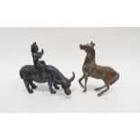 Metal model of a figure riding an ox together with a metal model of a horse (2)