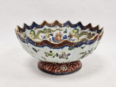 Chinese clobbered pedestal bowl with scalloped border, underglaze blue and enamel decoration of