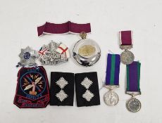 Regular service long service medal, a campaign service medal, a 1954-55 Egypt cloth badge, a compass