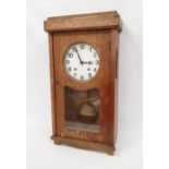 A substantial industrial style wall clock in oak veneered case, plain white painted dial with