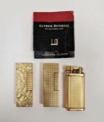 Three Dunhill lighters in a gold coloured finish (3).