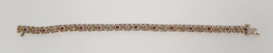 9ct gold bracelet set with ruby and diamonds, the gold in a cross-shaped pattern, 10.5g approx.