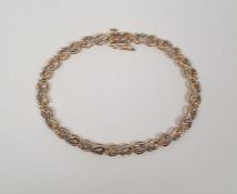 9ct gold bracelet set with tiny diamonds, marked on the clasp 0.50