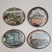 Four various oval set frames with glass domed fronts, printed continental scenes
