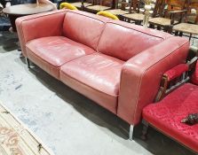 20th century red leather two-seat sofa of square form, raised on square-sectioned chrome effect
