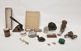 Two vintage whetstones, a fossil of a Trilobite, a book of stamps and assorted further collectable