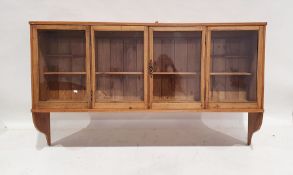 20th century pine wall-hanging display cabinet with four glazed cupboard doors, 97cm x 160cm x 36cm