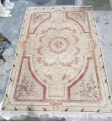 Large modern cream ground rug with central floral medallion with floral border  270cm x 184cm