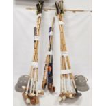 11 cane shafted polo mallets, two polo helmets, four hockey sticks and a lacrosse stick (18)