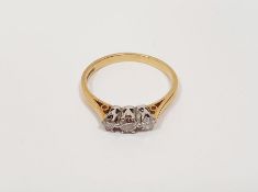 Gold and three stone diamond ring