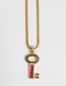 Theo Fennell 18K gold and ruby miniature key-pattern pendant and the herringbone-pattern flexible