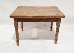 Pine kitchen table, the rectangular top with rounded corners, on turned supports, 73.5cm x 105cm x