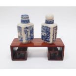 Two Chinese snuff bottles with wooden stand
