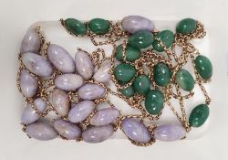 Two beaded and gold-coloured chain necklaces (both broken) with purple and green hardstones, on