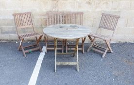 Wooden circular garden table and four folding garden chairs (5)  Condition ReportSurface