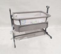 Modern baby's crib with mobile