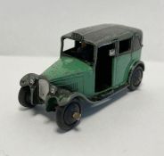 Playworn Dinky diecast car 36g taxi with driver green body, black wheels and top, Play worn Dinky