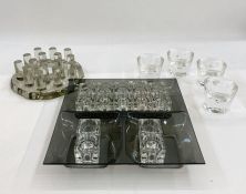 Set of four Pukeberg glass tealight holders together with assorted candle holders to include clear