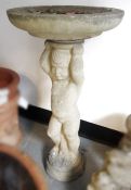 Composite stone bird bath, the base in the form of a cherub/young boy