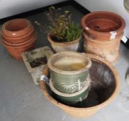 Quantity of terracotta and stoneware plant pots of varying sizes (12)