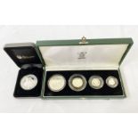 One 2003 silver Britannia coin set (4 coins), some toning and one 2013 Prince George Silver