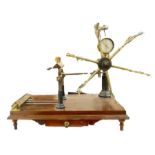 A Victorian brass yarn winder on wooden stand by John Nesbitt Ltd, 42 Market Street Manchester, 68cm