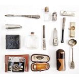 Silver-gilt cigar cutter, a silver salt spoon, a silver cigar cutter, a silver cheroot holder case