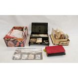 Assorted used stamps, empty stamp cases, purse of foreign coins, mixed coins and a silver locket (