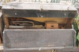 Vintage wooden tool box containing assorted tools to include saws, chisels, etc