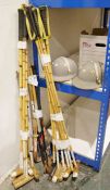 Quantity of polo sticks, 52" and 53" lengths, various hockey sticks and two grey polo helmets