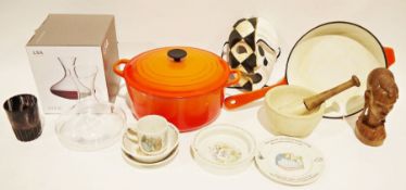 Le Creuset cast iron and orange enamel lidded casserole, a Le Creuset cast iron and orange enamel
