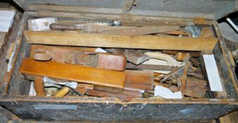 Vintage wooden toolbox containing various planes, files and other tools