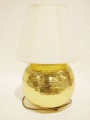 Modern spherical beaten brass table lamp