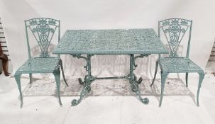 Cast metal painted garden table and six chairs with pierced floral decoration (7) Condition