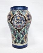 Middle Eastern inverse baluster vase with panelled decoration, indistinctly signed to base, 27cm
