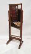 Early 20th century oak-framed cheval mirror of rectangular section, the frame incised with dot and